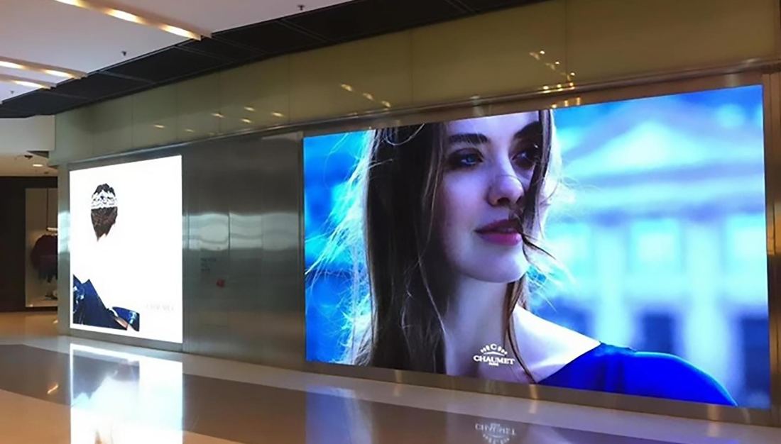 Indoor fine-pitch LED video wall showing a close-up portrait in high detail
