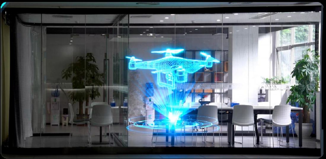 Holographic transparent LED screen showing a floating 3D object